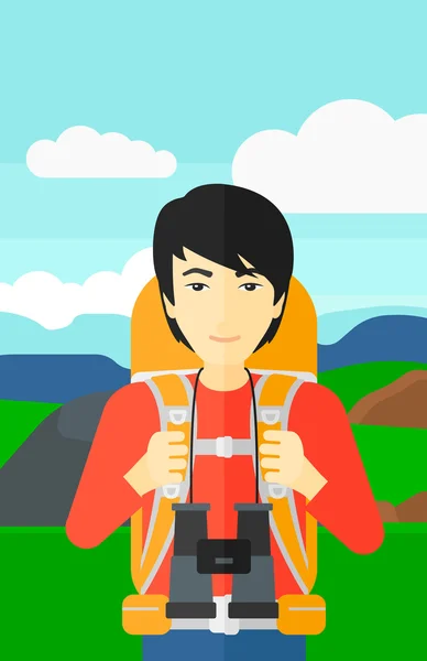 Cheerful backpacker with binoculars. — Stock Vector