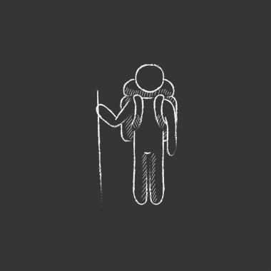 Turist backpacker. Tebeşir simgesinde çizilmiş.