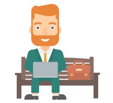 Dizüstü bilgisayarda çalışan adam.