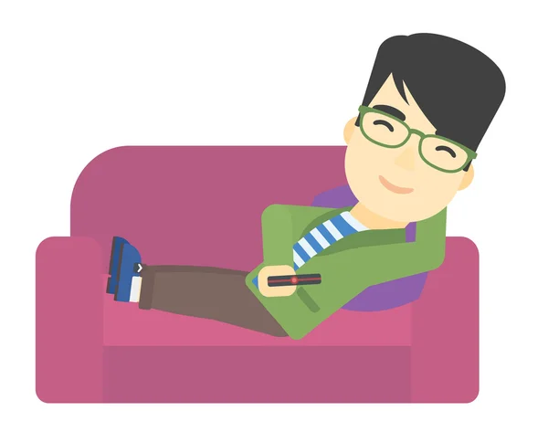 Mann sitzt mit Fernbedienung auf der Couch. — Stockvektor