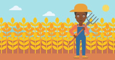 Çiftçi dirgen ile.