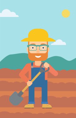 Kürek ile sahada çiftçi.