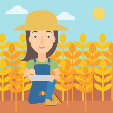 Tablet bilgisayarda alan ile çiftçi.