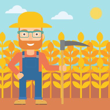 Çiftçi tırpan ile sahada.