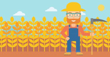 Çiftçi tırpan ile sahada.