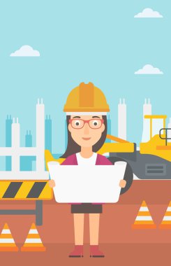 Bir plan tutan mühendisi.