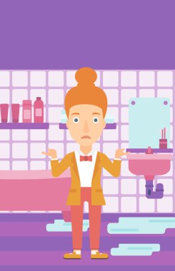 Kadın umutsuzluk ayakta sızdıran lavabo yakınındaki.