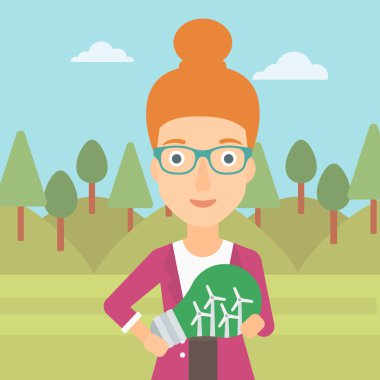 Ampul yel içinde tutan kadın.