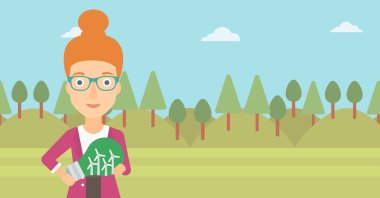 Ampul yel içinde tutan kadın.