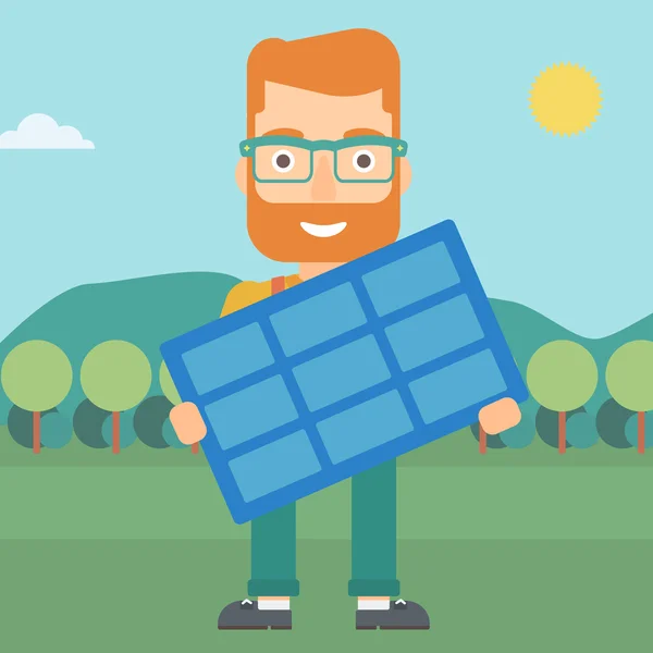 Hombre sosteniendo panel solar . — Vector de stock
