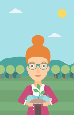 Şişede büyüyen bitki kadınla.