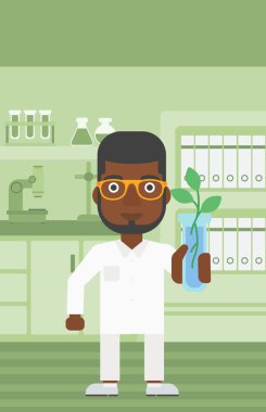 Test tüplü laboratuar asistanı.