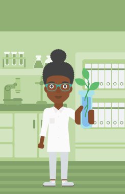 Test tüplü laboratuar asistanı.