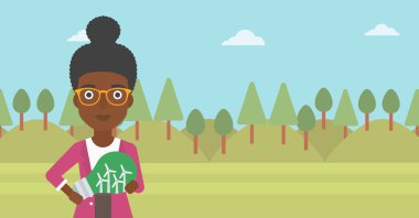 Ampul yel içinde tutan kadın.