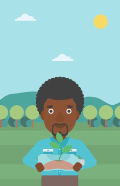 Şişede büyüyen bitki olan adam.