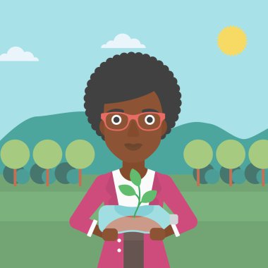 Şişede büyüyen bitki kadınla.