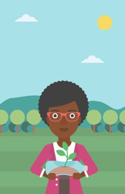 Şişede büyüyen bitki kadınla.