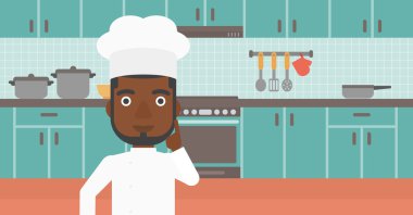 Chef pointing forefinger up.