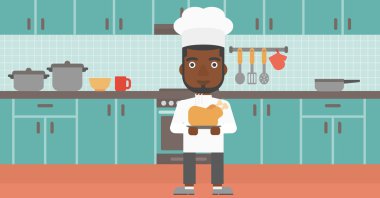 Man holding roasted chicken.