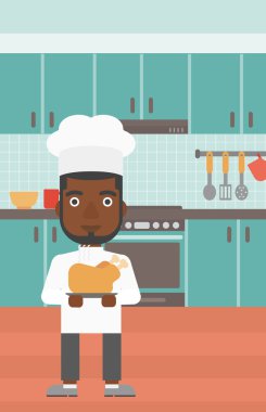 Man holding roasted chicken.