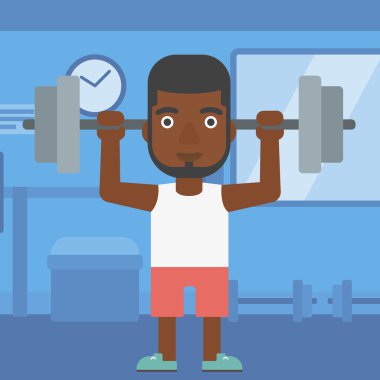 Adam halteri kaldırıyor..