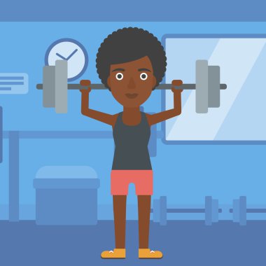 Kadın halter kaldırıyor..