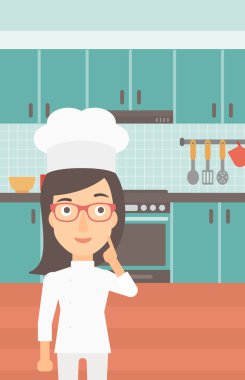 Chef pointing forefinger up.