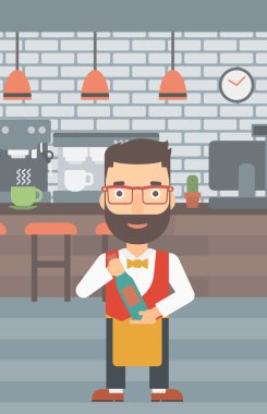 Garson holding şişe şarap.