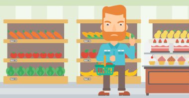 Süpermarket sepeti tutan adam.