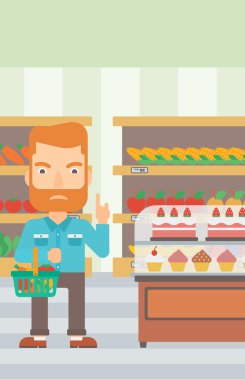 Süpermarket sepeti tutan adam.