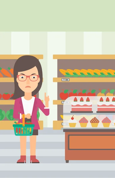 Mujer sosteniendo cesta de supermercado . — Vector de stock