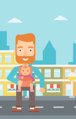 Adam tutarak bebek askı içinde.