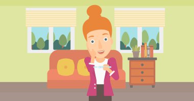 Hamilelik testi olan kadın.