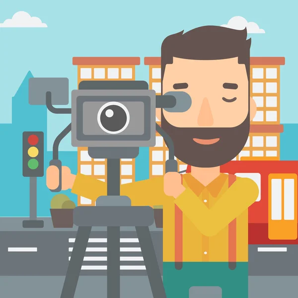 Cameraman with movie camera on a tripod. — Stock Vector