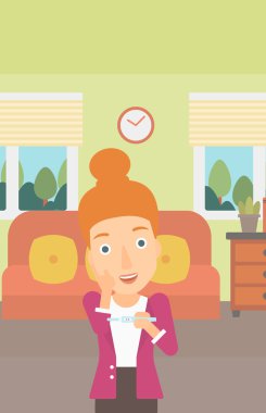 Hamilelik testi olan kadın.