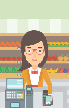 Customer paying with smartphone using terminal.