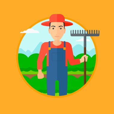 Lahana tarlasında tırmık ile Çiftçi.