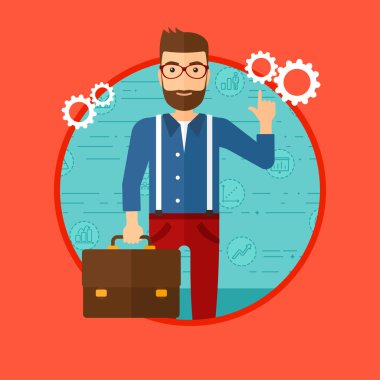 Businessman pointing at cogwheels.