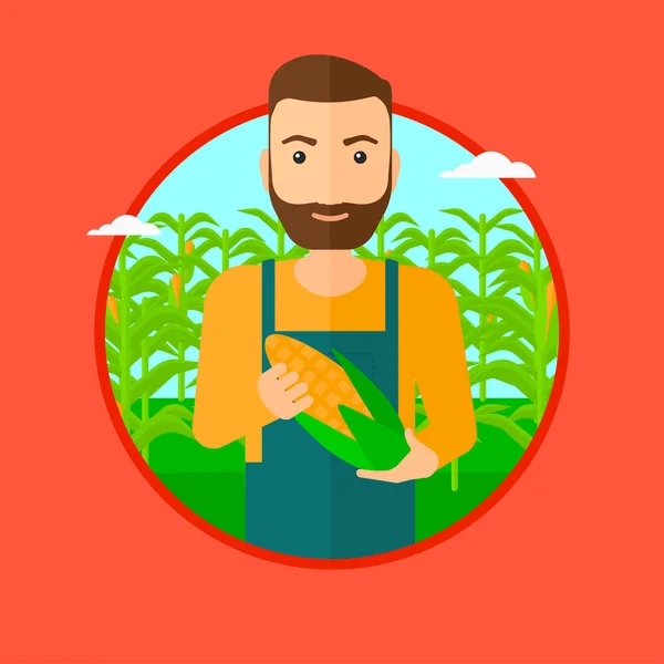 Farmář hospodářství kukuřice. — Stockový vektor