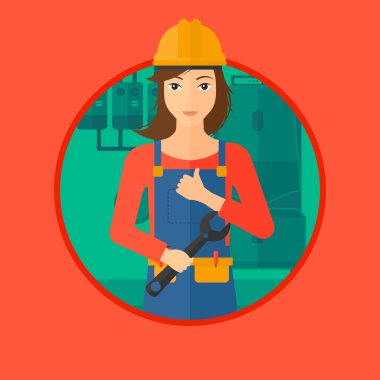 Somun anahtarı ile neşeli tamirci.