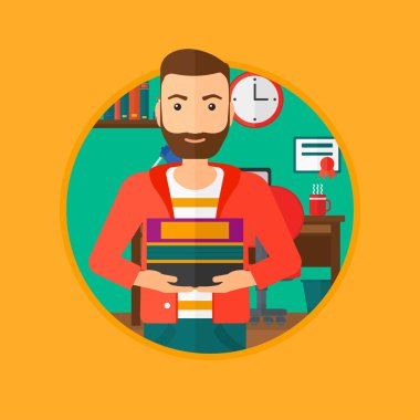 Adam holding yığın kitap.