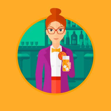 Woman drinking orange cocktail at the bar.