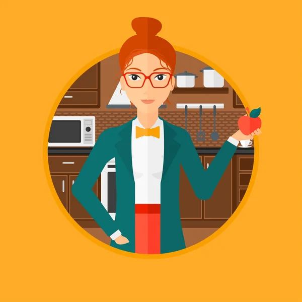 Mujer joven con manzana en la cocina . — Vector de stock