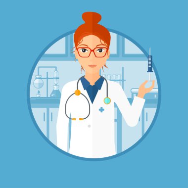 Laboratuvarda şırınga ile laboratuvar asistanı.