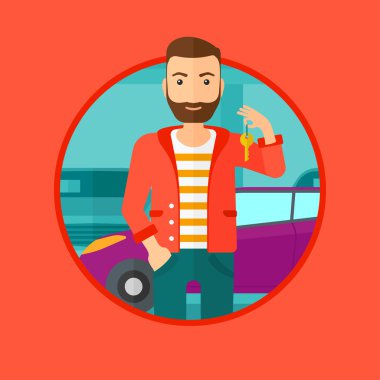 Yeni arabasının anahtarları tutan adam.