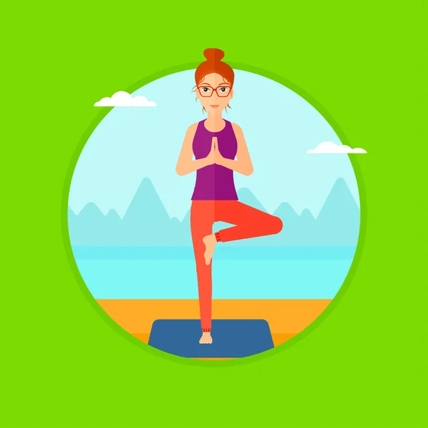 Woman practicing yoga tree pose on the beach. — Stockvector