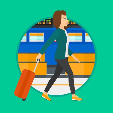 Havaalanında bavul ile yürüyen kadın.