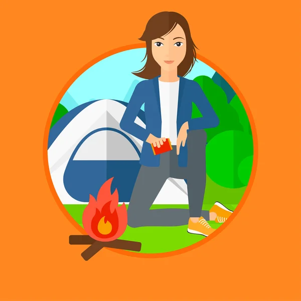 Woman kindling campfire. — Stock Vector