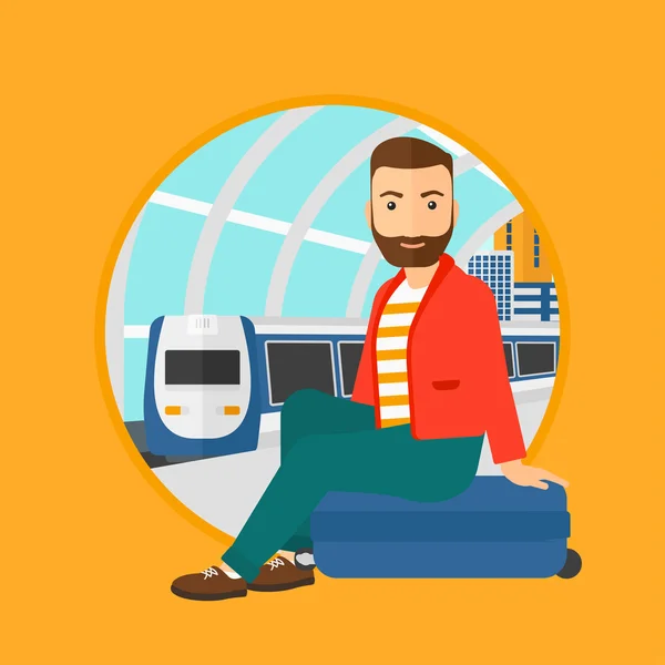 Muž, který sedí v kufru na vlakovém nádraží. — Stockový vektor