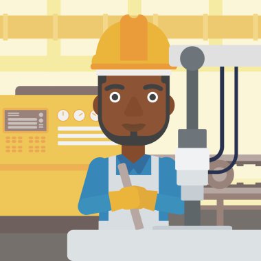 Sondaj makinesi endüstriyel üzerinde çalışan adam.